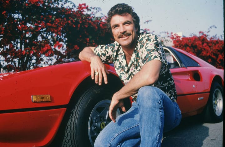 What baseball team's hat does Magnum wear in Magnum, P.I.?